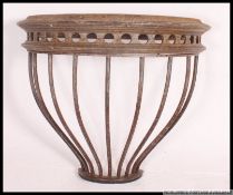 A 19th century cast iron agricultural hay feeder being converted to a side table ( see