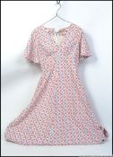 A retro bespoke dress possibly from an Made in Britain advertising campaign possibly size 12 - 14
