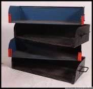 A collection of vintage mid 20th century industrial painted metal Tote trays taken from the ex