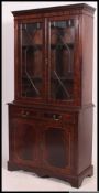 A Regency style mahogany inlaid library bookcase cabinet.