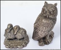 A silver white metal novelty owl stamped 925 along with a silver white metal pair of ducks stamped