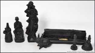 A group of 7 Kingmakers coal sculptures to include Miner , Mother holding child ,