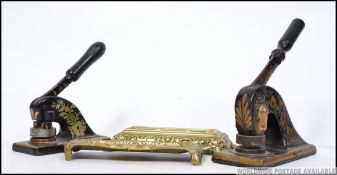 Two Victorian raised in relief brass pen trays along with a pair of decorative Victorian paper