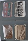 A fantastic early 20th century postcard album containing many transport related train cards,