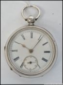 A Victorian silver hallmarked gentlemans pocket watch having enamel face with subsiduary seconds