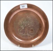 A Keswick School of Industrial Arts circular copper plate with tree,