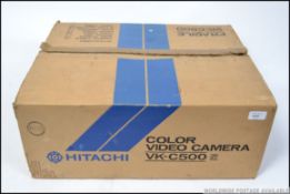 A boxed retro Hiachi VK-C500E video camera,
