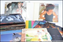 A collection of long play vinyl albums dating from the 1980's to include Dire Straits, UB 40,