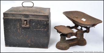 A Victorian cast iron set of balance scales by Day and Millward Birmingham with weights along with