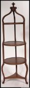 An Edwardian mahogany inlaid 3 tier bell shaped cake stand.