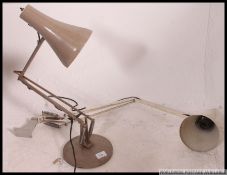 A post war beige anglepoise desk lamp by Herbert Terry having circular base and pendant shade.