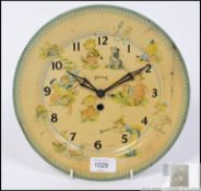 A fantastic vintage early 20th century wall hanging mechanical tin plate clock by Smiths,