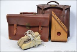A vintage slimline ring dial BT telephone together with a vintage leather satchel and a wooden