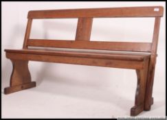 A Victorian country pine double sided metamorphic refectory bench.