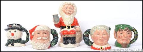A group of 7 Christmas themed Royal Doulton Character toby jugs to include Snowman D6972 ,