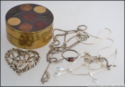 2 silver ladies contemporary necklaces together with a silver ring.