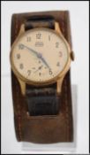 A 1950's Smiths Astral 15 Jewels Gentleman's brass and stainless steel wristwatch.