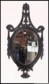 A fabulous large Victorian style aesthetic movement mirror in the adams revival style having ornate