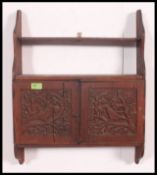 A Lloyd Loom style whicker armchair together with a wall hanging cabinet and another.