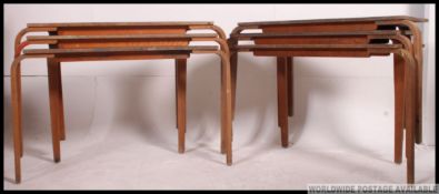 A stack of vintage 20th century stacking school desks.