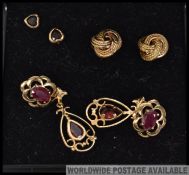 A collection of 9ct gold earrings to include heart shaped, swirl, stone set etc.