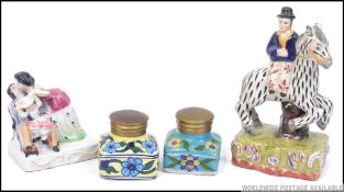 A Staffordshire flatback figurine of a zebra and seated gentleman together with a continental