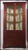 A 19th century Georgian large mahogany corner cabinet.