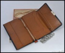 A collection of vintage early to mid 20th century costume jewellery to include pearls, brooches,