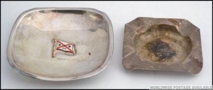 A silver and enamel set peanut dish bearing the shipping line flag for Sartori & Berger (German