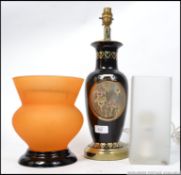 Two 20th Century lamps to include a 24ct gold trimmed lamp and a glass rectangular form lamp along