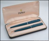 A cased retro Parker 43 convertible fountain pen along ith a matching Parker ball point pen,