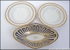 A pair of Grainger and Co 19th century Worcester dishes having applied gilt edge,
