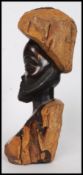 An African tribal of polished carved hardwood of a bearded tribesman.