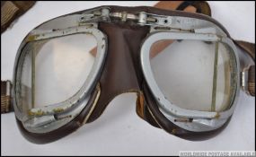 A pair of mid century Stadium pilot / motorcycle / driving goggles retaining the glass lenses all