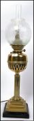 A stunning early 20th century brass oil lamp of neo classical form with glass flue and stunning