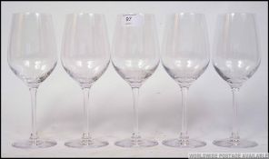 A collection of five Dartington glass wi