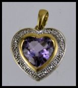 A 9ct gold amethyst and diamond set neck