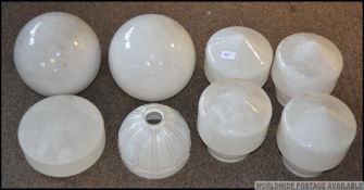 A set of 4 mid century white glass bolla