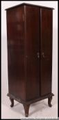 A 1920's mahogany office filing cabinet.