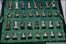 A 20th century velour cased chess set. E