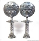 A pair of unusual white metal large sun