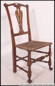 A 19th century country oak and rush seat