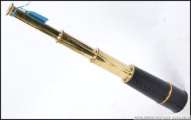 A brass and leather cased draw telescope