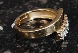 A 9ct gold hallmarked Birmingham dress ring set with clear pave set stones in an overlapping twin