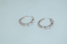 A pair of 925 silver hoop earrings with prong set CZ stones and lever backs. Weight 5g.