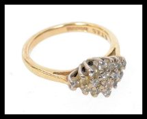 A hallmarked 9ct gold ring set with 16pts diamonds. Weight 2.7g. Size H.