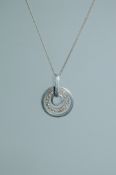A 925 silver pendant necklace strung with an articulated CZ set halo pendant on a fine silver chain.
