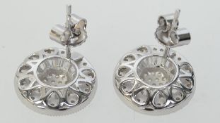 A pair of 925 silver Art deco style earrings set with halo baguette and round cut CZ with pierced