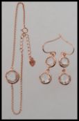 A 925 silver gold plated earring and bracelet set with Morganite style faceted bezel set pendant