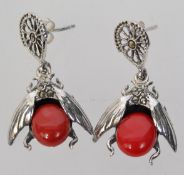 A pair of 925 silver Art Deco style bug earrings set with a coral style stone body with marcasite